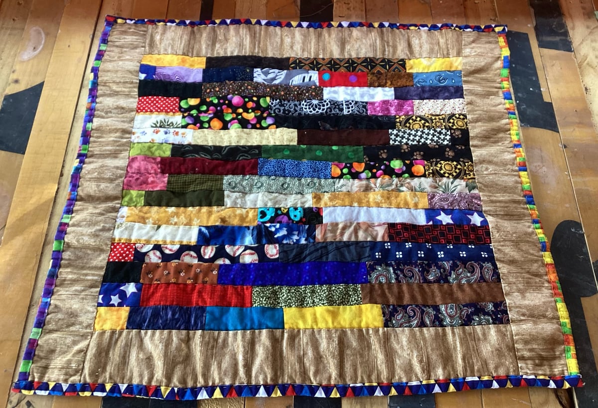 Image of Scrappy Strip Quilt For Cats