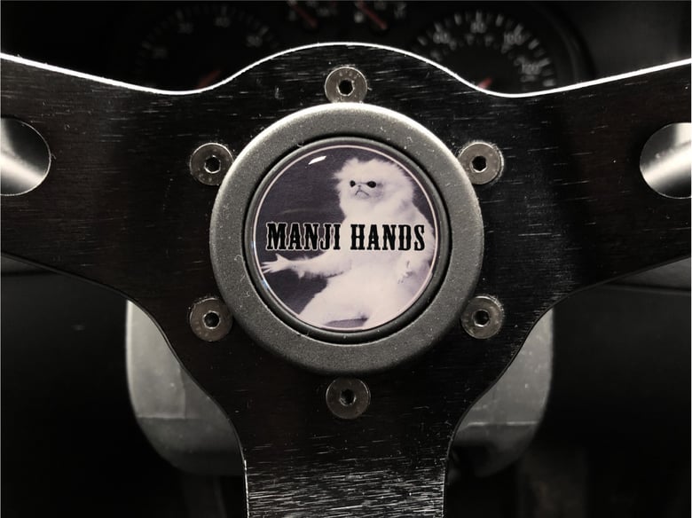 Image of Manji Hands Hornpush Sticker 40mm Domed