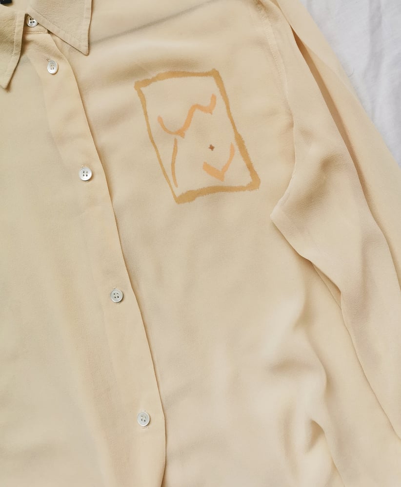 Image of pale gold blouse