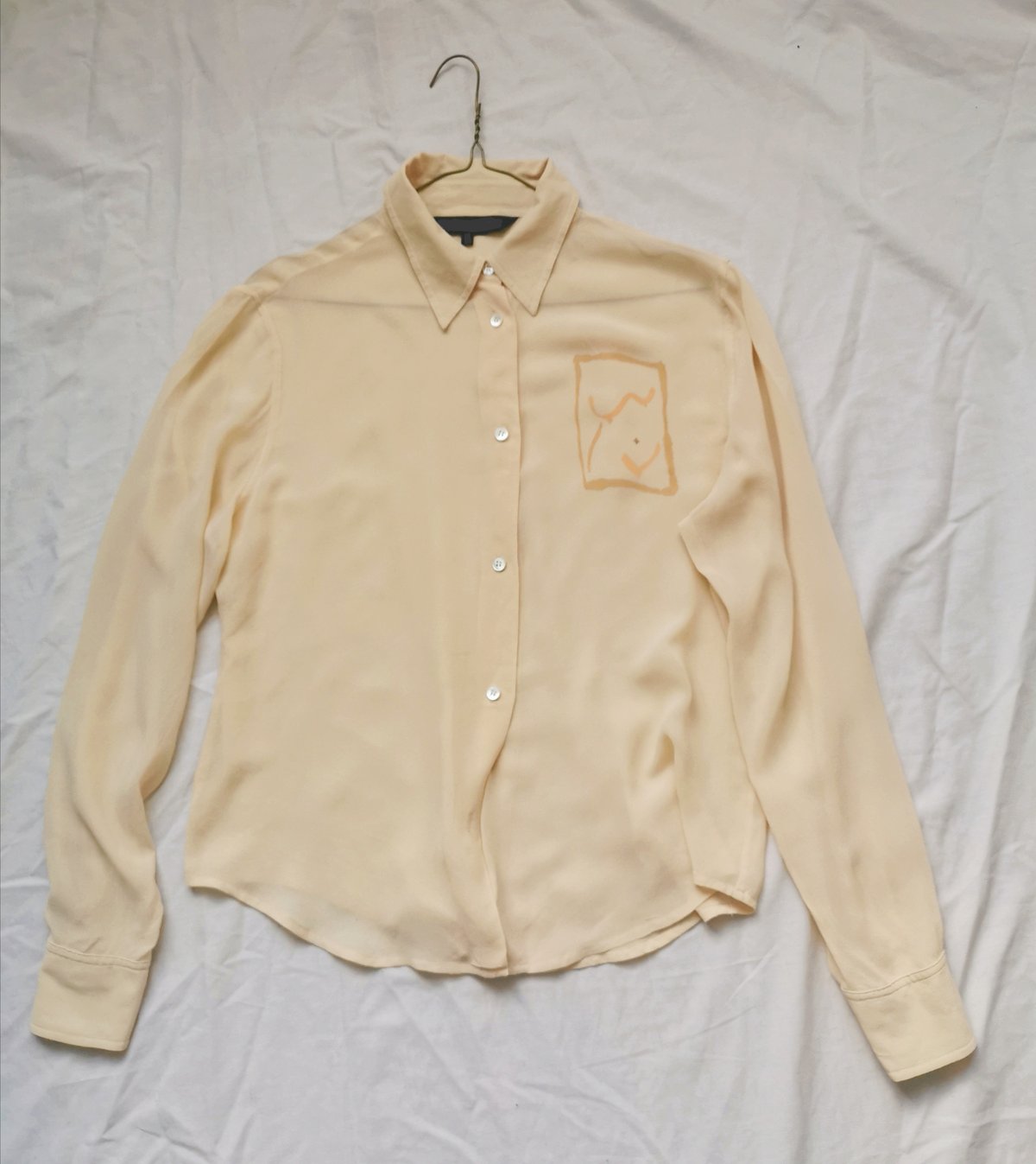 Image of pale gold blouse