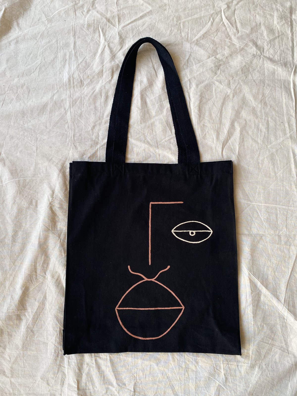 Image of eye face tote 