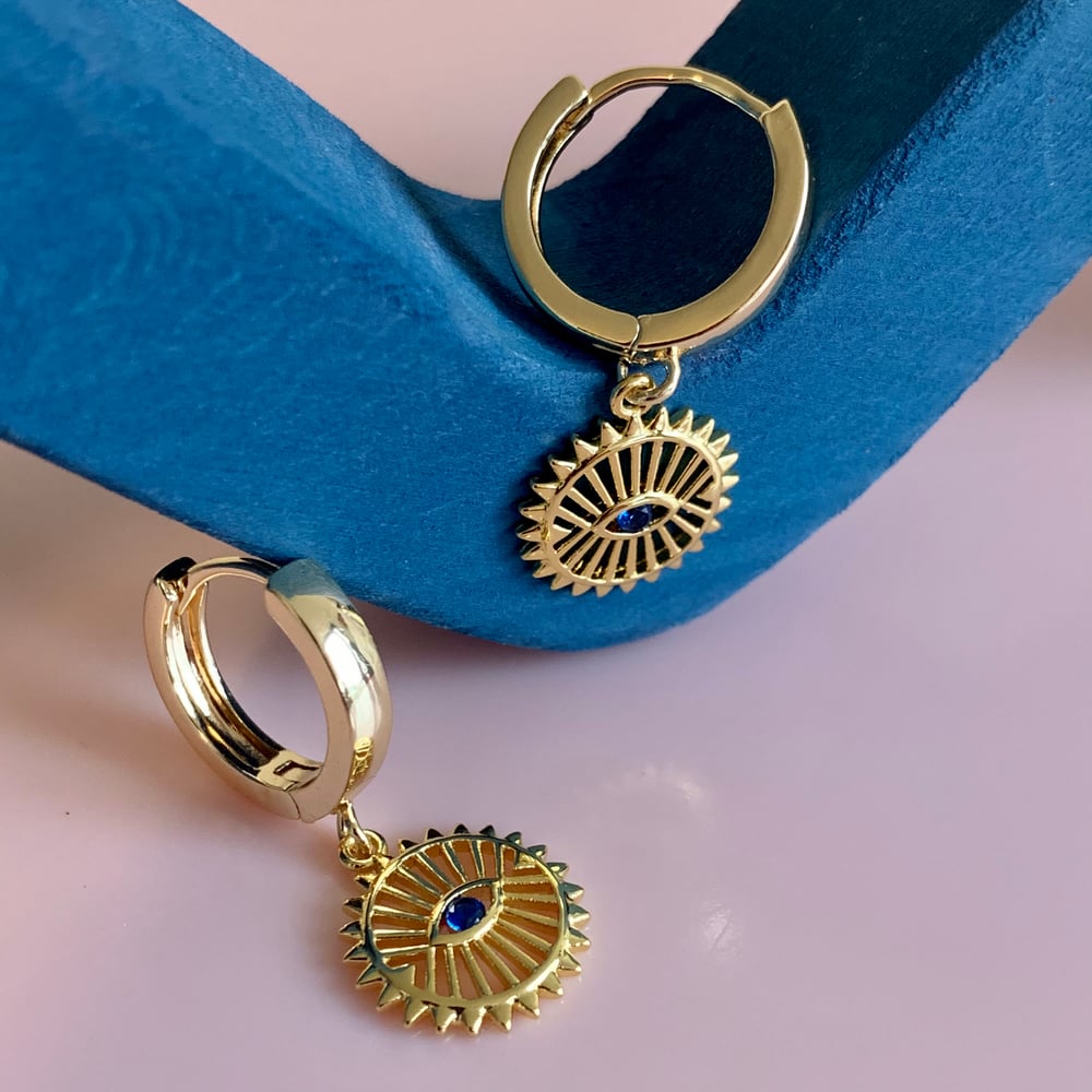 Image of Gold Sun Eye Huggie Hoops