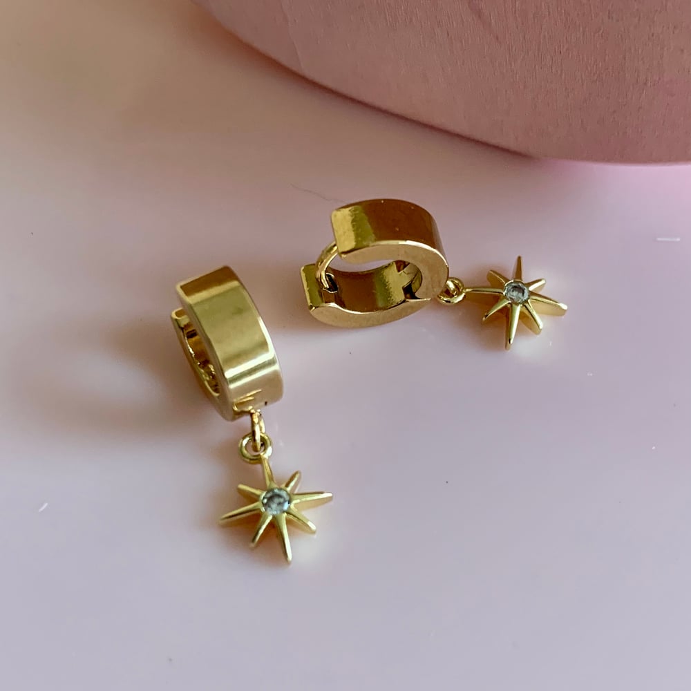 Image of Gold Pointed Star Huggie Hoops 