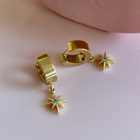 Image of Gold Pointed Star Huggie Hoops 