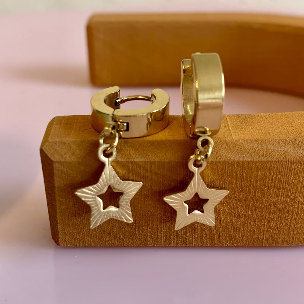 Image of Gold Five Point Star Huggie Hoops 