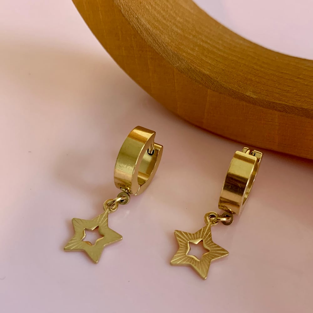 Image of Gold Five Point Star Huggie Hoops 