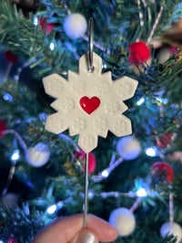 Image 4 of Snowflake with a heart on a wire stake 