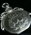 EDWARDIAN 9CT HEART LOVERS KNOT SWIVEL LOCKET PENDANT 6.4g