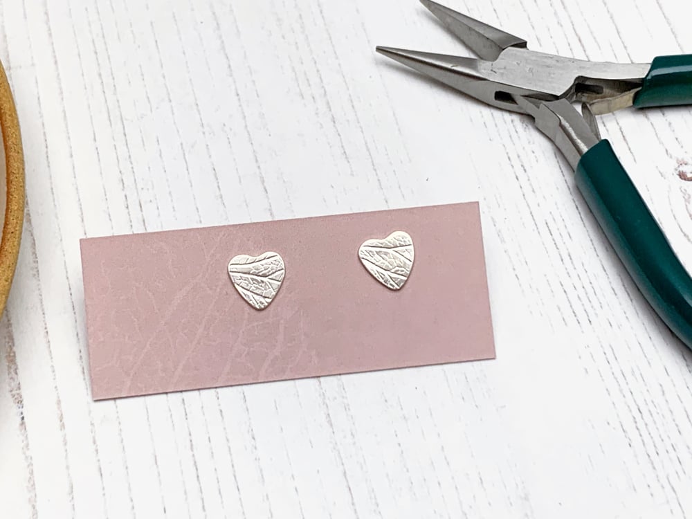 Image of Petal imprint heart studs, recycled sterling silver. 