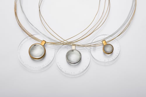 Image of "Bringer of the sun" gold plated silver pendant with rock crystal · SOLIFER ·