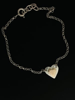 Image of Heart shaped silver bracelet with 9ct gold