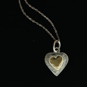 Image of Heart shaped silver necklace with 9ct gold