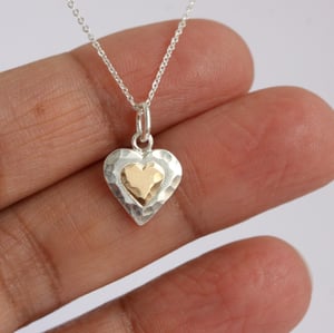Image of Heart shaped silver necklace with 9ct gold