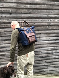 Image 1 of Convertible backpack in waxed canvas with leather outside pocket and cross body strap