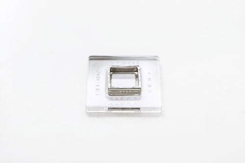 Image of polished  silver square ring with inscription in Latin