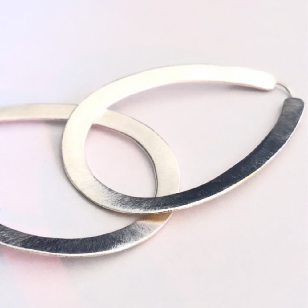 Image of Arracades Sort (plata i or).Pendientes Sort.