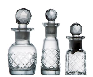 Image of etched glass perfume bottles trio