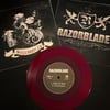 Razorblade / Suckered In - Split 7”