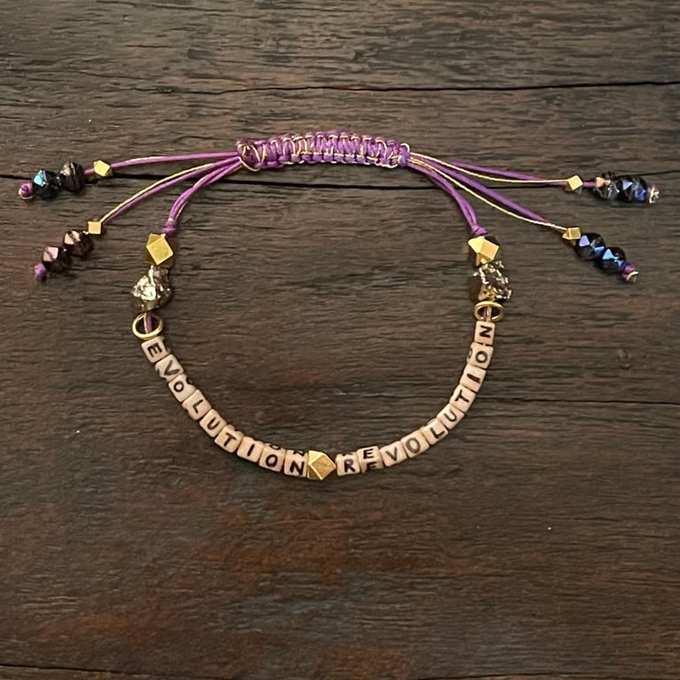 purple EVOLUTION REVOLUTION bracelet