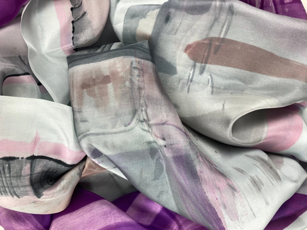 Image of Silk scarf. Soft greys, black beige and powder pink with one purple.