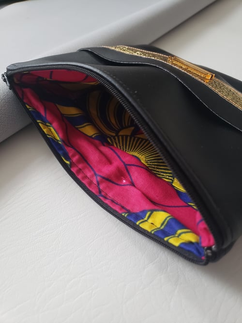 Image of Black Gold Clutch With Hand Strap