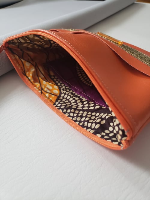 Image of Neon Orange Gold Clutch With Hand Strap