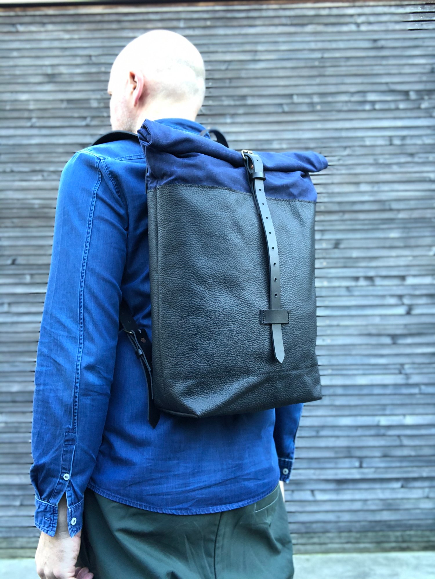 Image of Leather backpack with waxed canvas roll to close top 