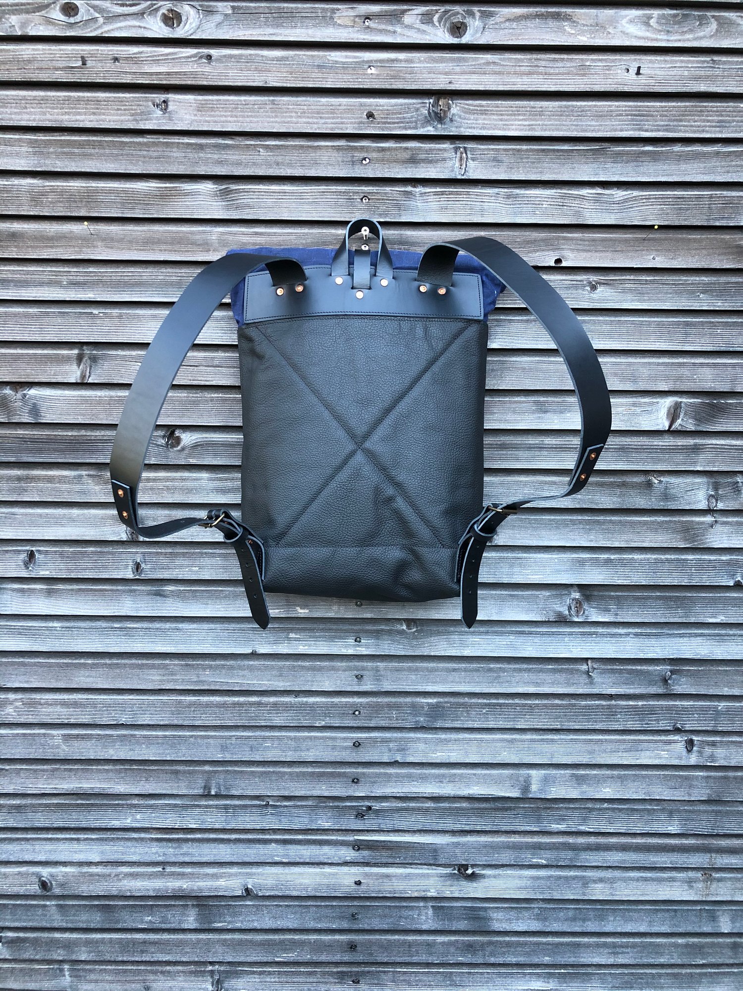 Image of Leather backpack with waxed canvas roll to close top 