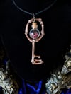 Crystal Filled, Glass Globe Charm - Bone Skeleton key Pendant. 