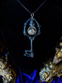 Crystal Filled, Glass Globe Charm - Bone Skeleton key Pendant. 