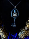 Crystal Filled, Glass Globe Charm - Bone Skeleton key Pendant.