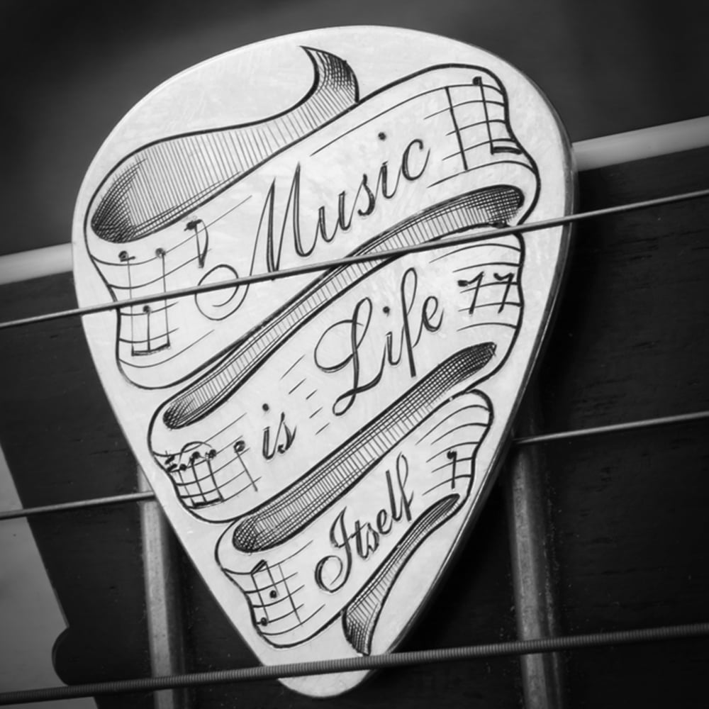 Custom made Sterling Silver Guitar pick 