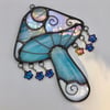 Iridescent blue and iridescent white clouds Catch a falling star mushroom suncatcher