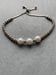 Image of Silver and Pearl drawstring bracelet