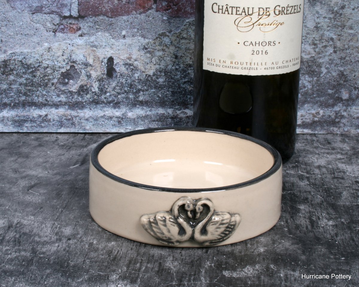 Image of Wine bottle coaster in creamy white porcelain with a pair of swans