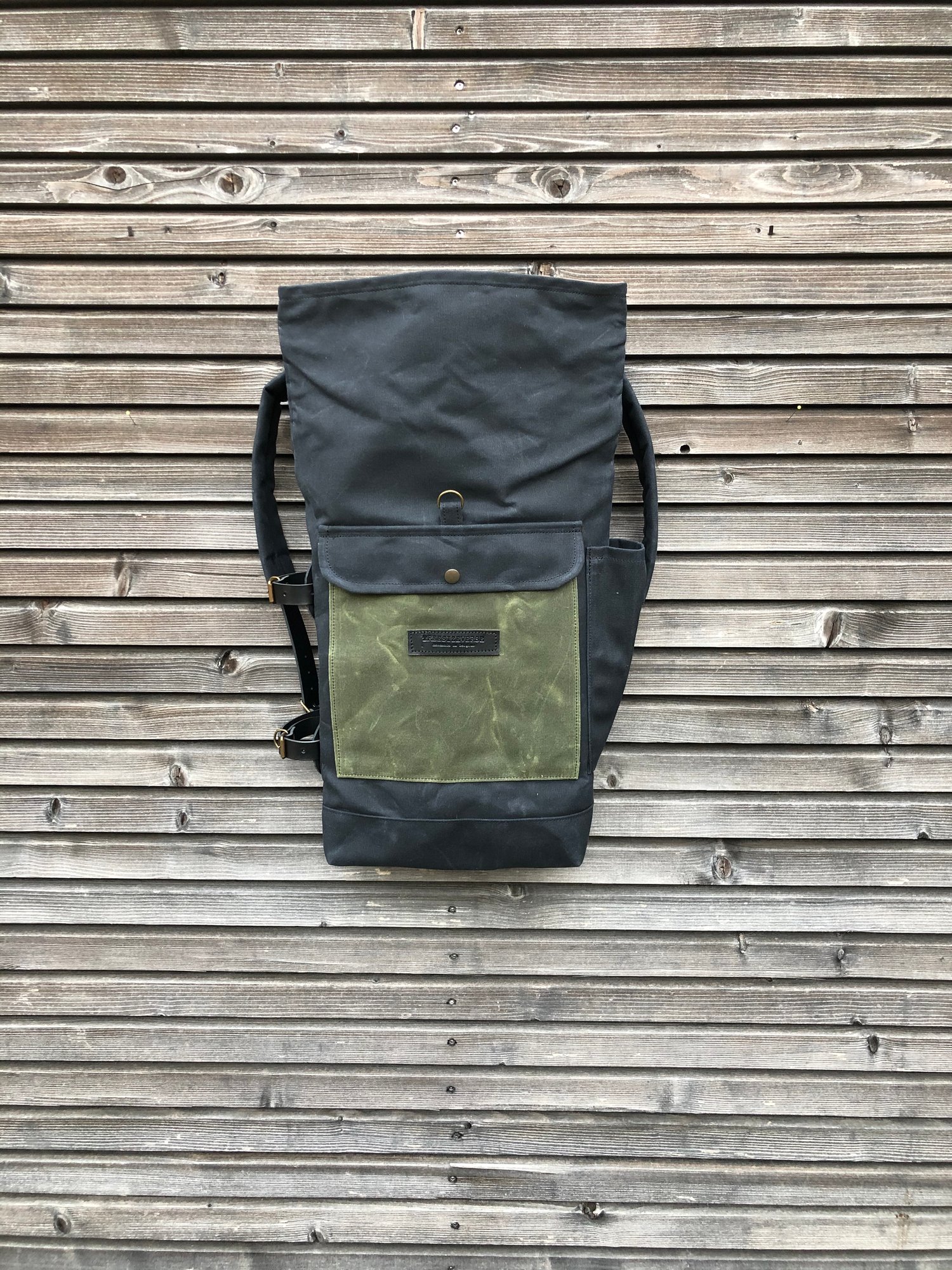 Image of Waxed canvas backpack with detachable leather side straps and padded laptop compartment / padded sho