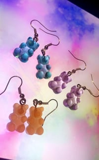 Light blue , orange and light purple gummy bear earrings.