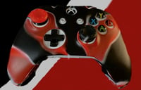 Red and black controller and grips bundle, comes with 1 controller skin and 1 black grip and 1 red.