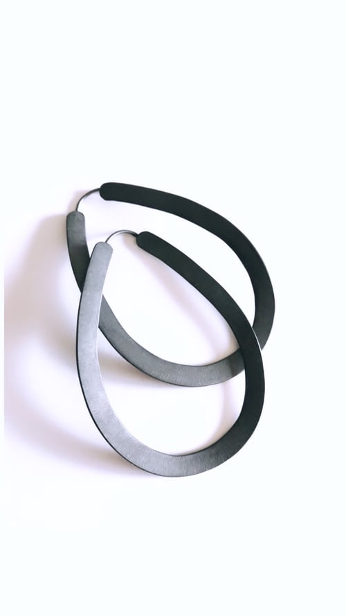 Image of Arracades Sort (plata i or).Pendientes Sort.