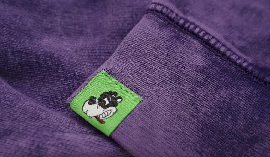 Image of "Skunk." Hoodie (purple/slimegreen)