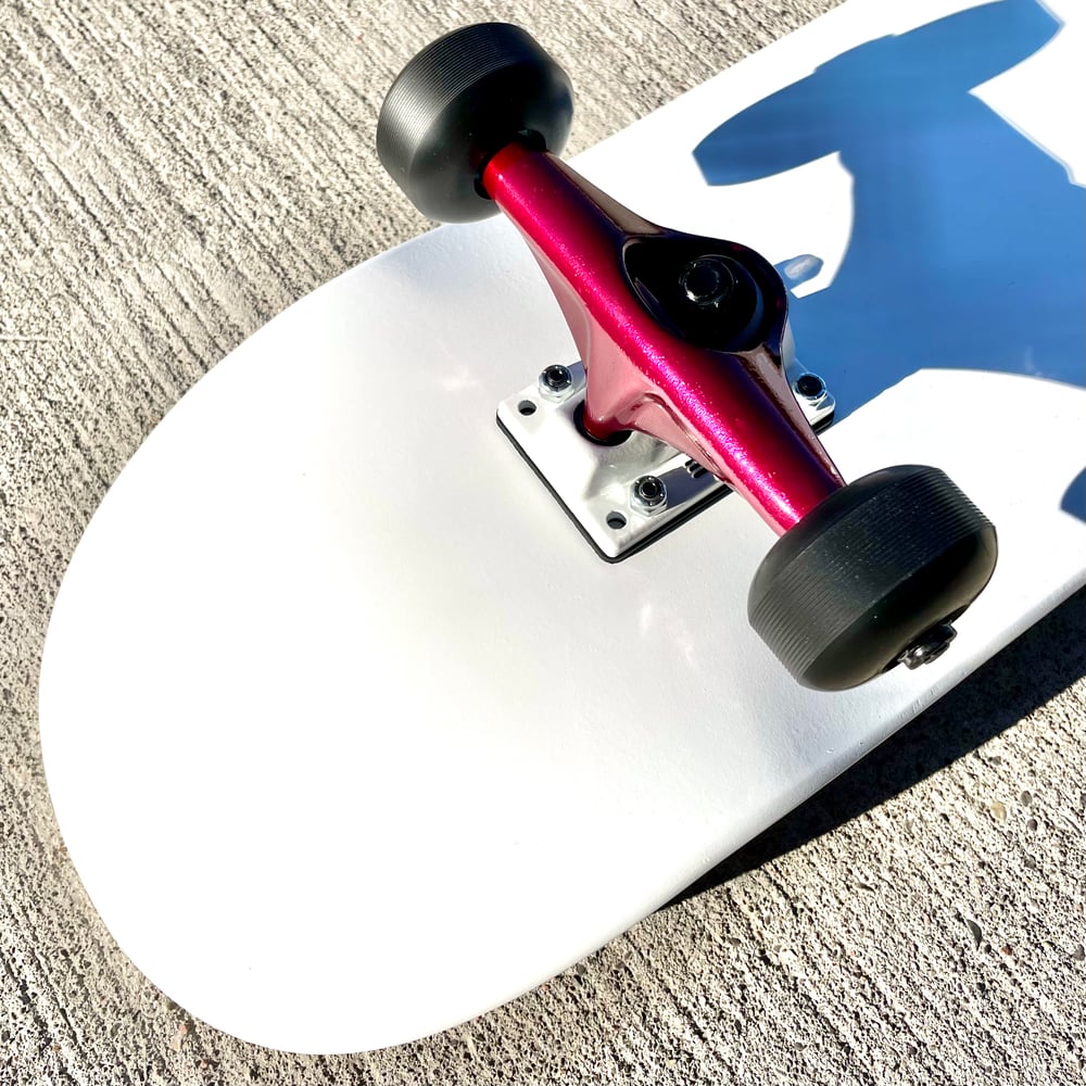 Image of White Complete Skateboard w/ Metallic Red Trucks