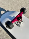 White Complete Skateboard w/ Metallic Red Trucks