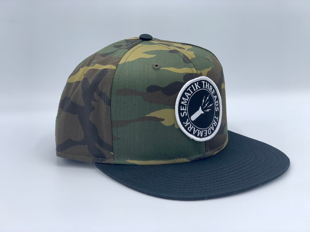 Image of SEMATIK LOGO SNAPBACK HAT - CAMO