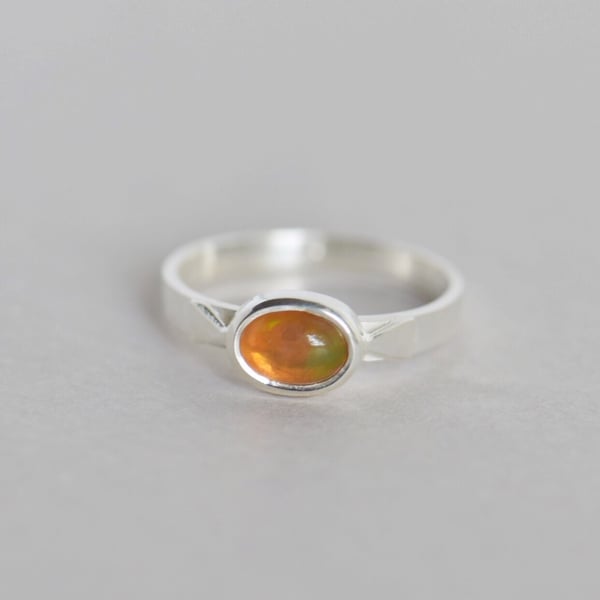 Image of Fire Opal cabochon cut oval shape flat band silver ring