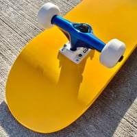 Image 1 of Yellow Complete Skateboard w/ Metallic Blue Trucks