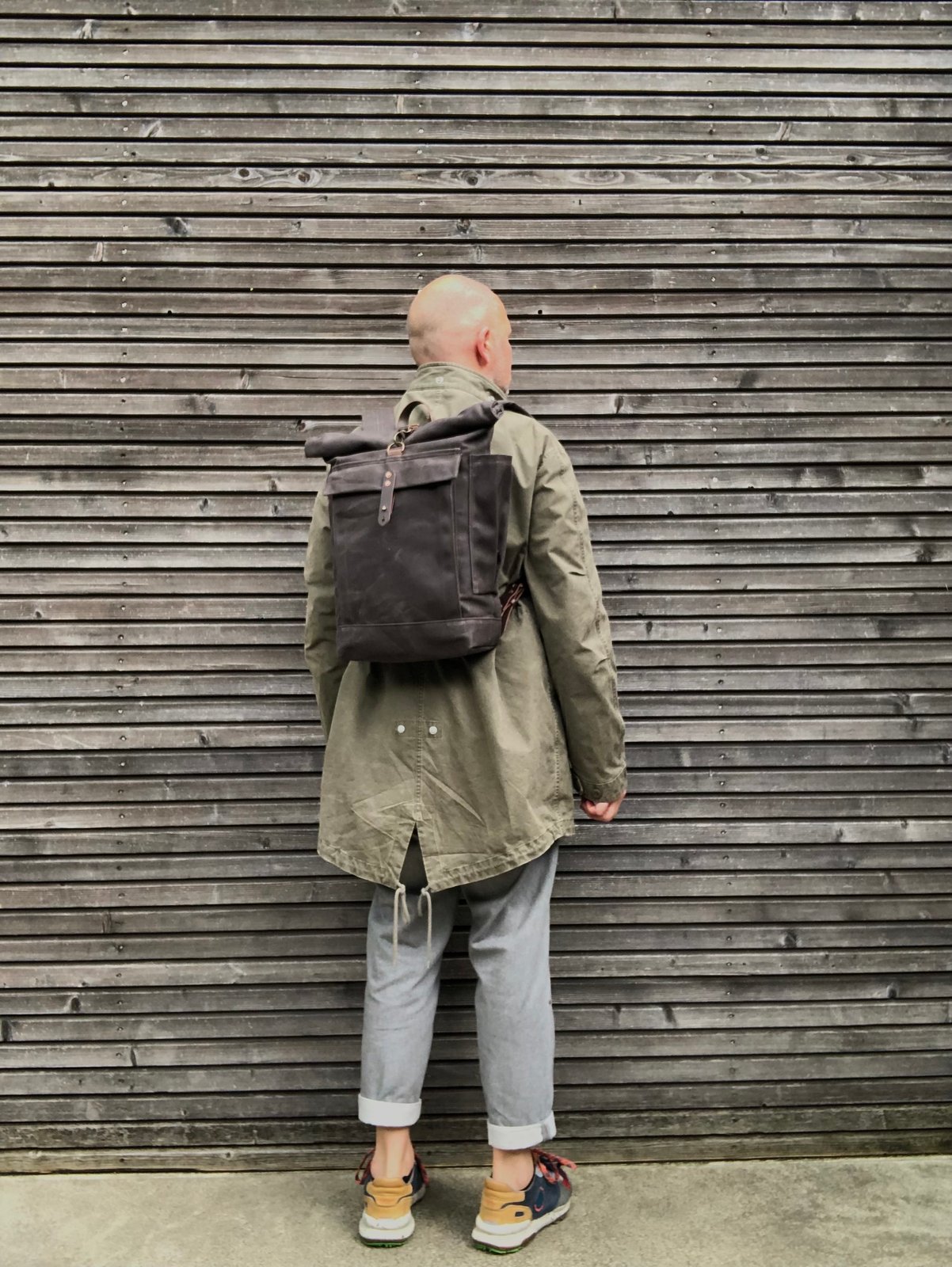 Canvas backpack with outlet water bottle pocket