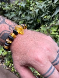 Image 3 of Bog oak and Amber skull bracelet. 