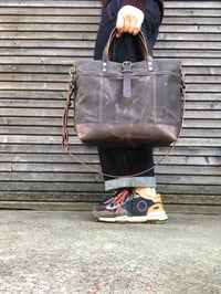Image 1 of Tote bag in grey brown waxed canvas with leather bottom and cross body strap