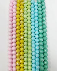 Image 3 of Painted glass bead strands.