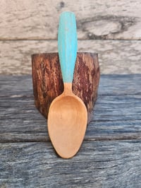 Image 1 of Schinus eating spoon. 